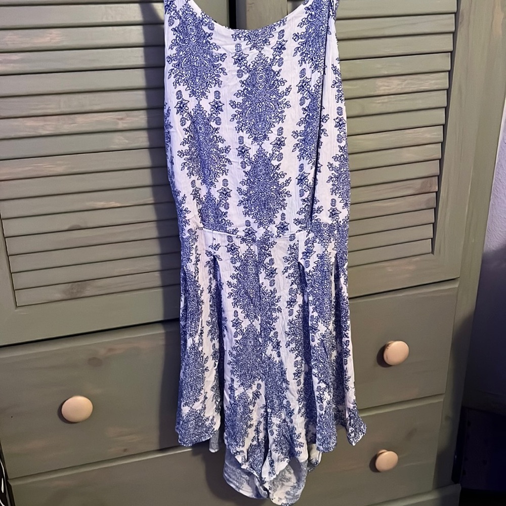 Blue one piece short outfit. Open tie back. Stretchy. Flowy.